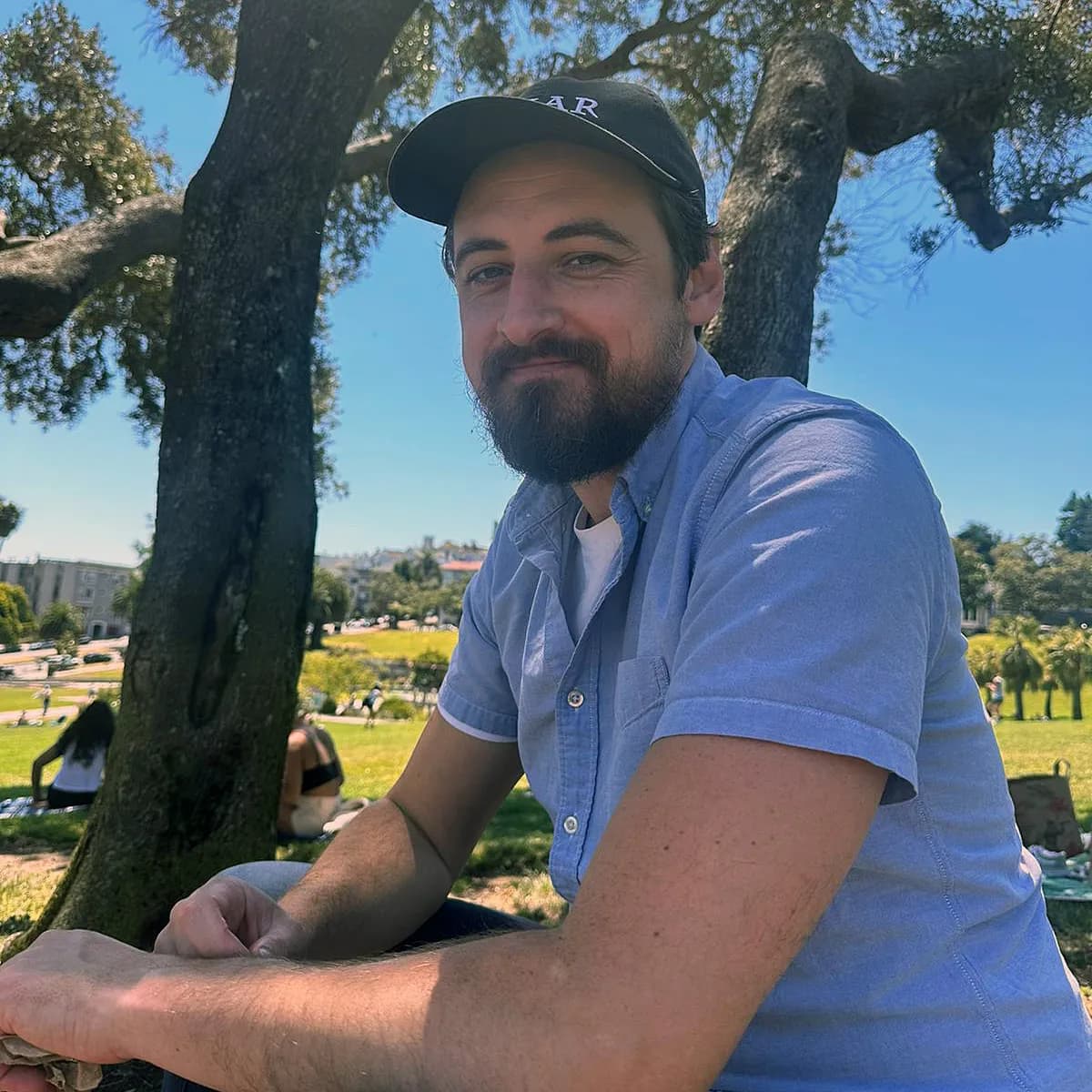 Zac, enjoying himself at Dolores Park with friends and thinking about the sushi he's about to eat.